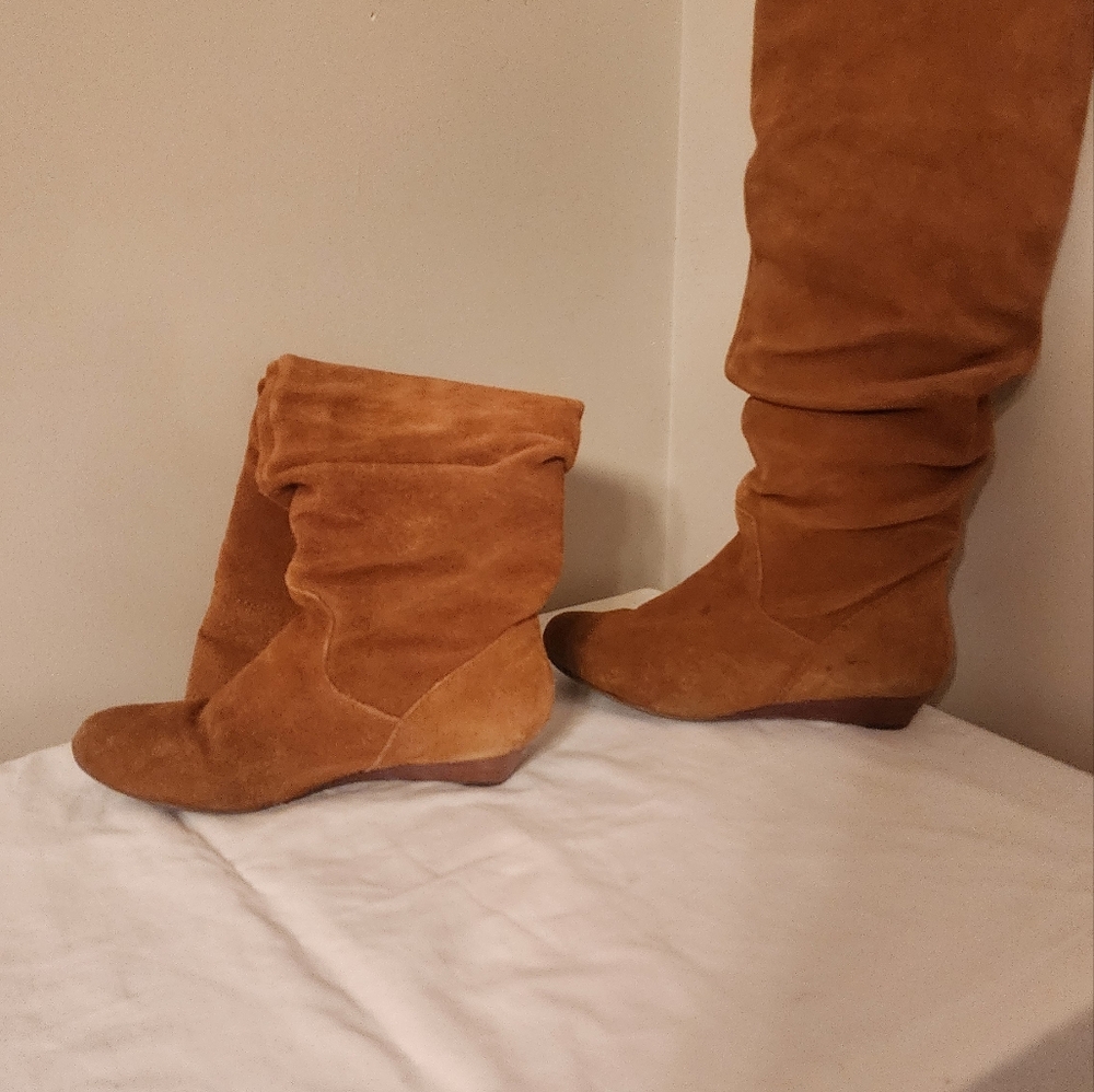 Beige leather boots over the knee